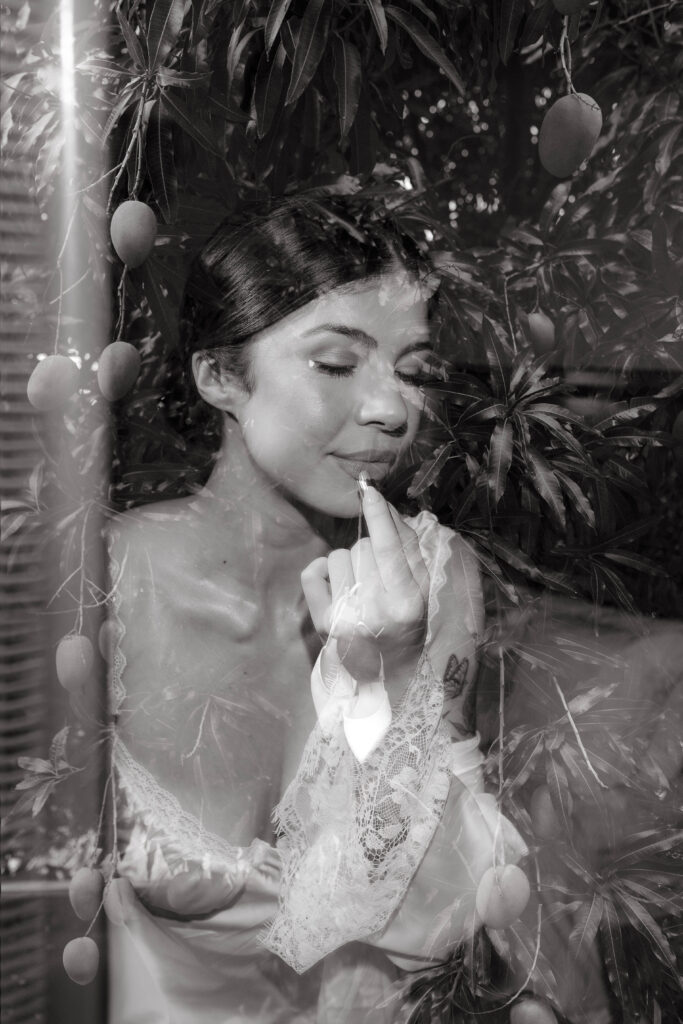 Double exposed image of bride putting on her lipstick before her wedding ceremony at La Haut Resort in St. Lucia.