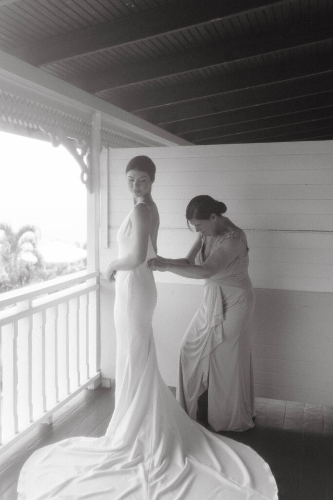 getting in wedding dress with mother at La Haut Resort in St. Lucia.