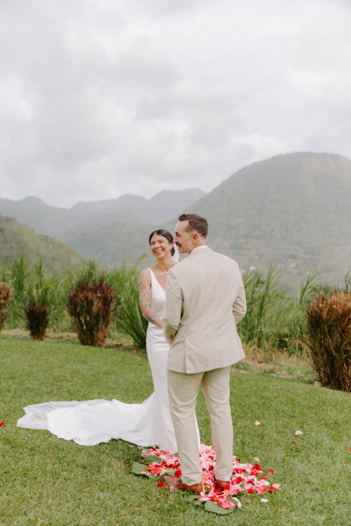 Bride and groom exchanging vows with the Pitons in the background at La Haut Resort in St. Lucia.
