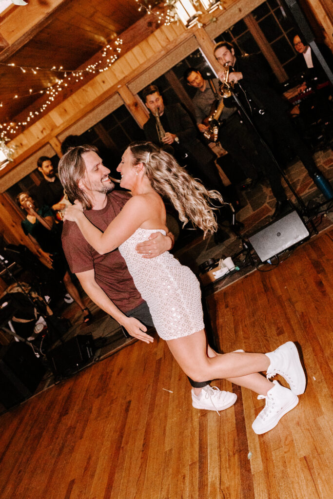 Bride and groom dancing at wedding reception at Migis Lodge