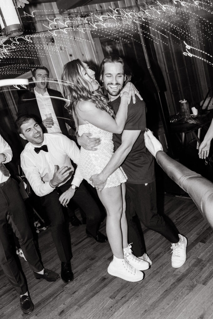Bride and groom dancing at wedding reception at Migis Lodge