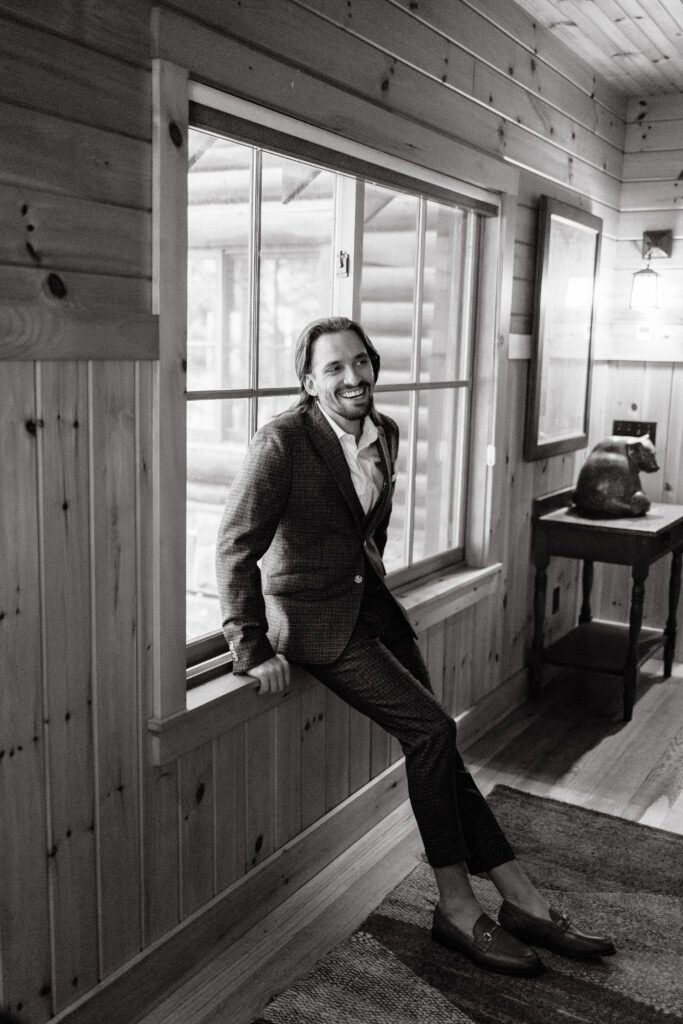 Groom gets ready for wedding day at Migis Lodge on Sebago lake