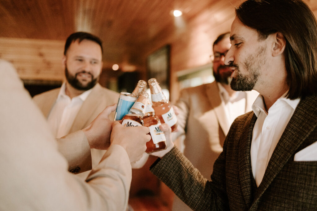 Groom gets ready for wedding day at Migis Lodge on Sebago lake