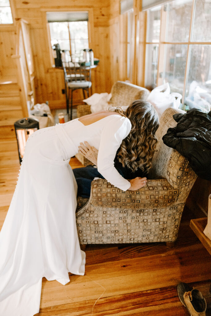 Bride and grandma exchange hugs and tears on wedding day at Migis Lodge