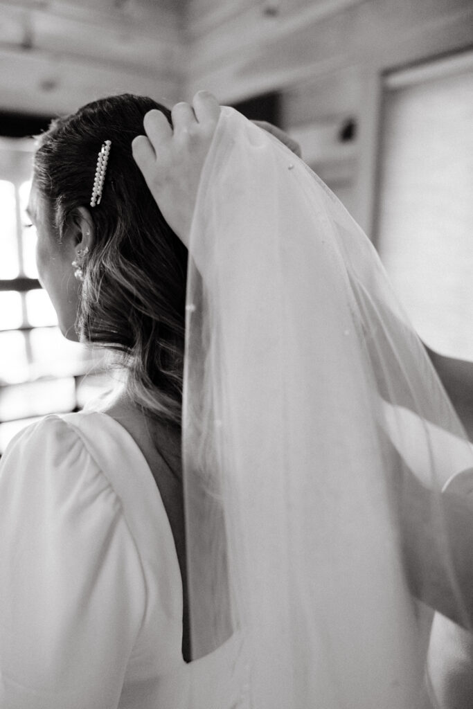 Bride gets ready for wedding day at Migis Lodge on Sebago lake