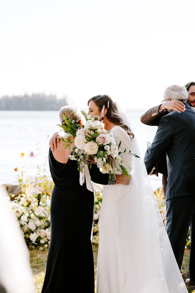 Wedding ceremony at Migis lodge lawn on Sebago lake, Maine