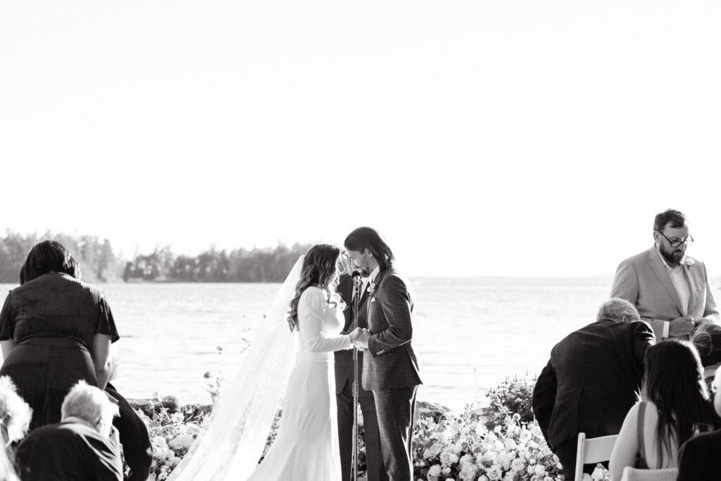 Wedding ceremony at Migis lodge lawn on Sebago lake, Maine