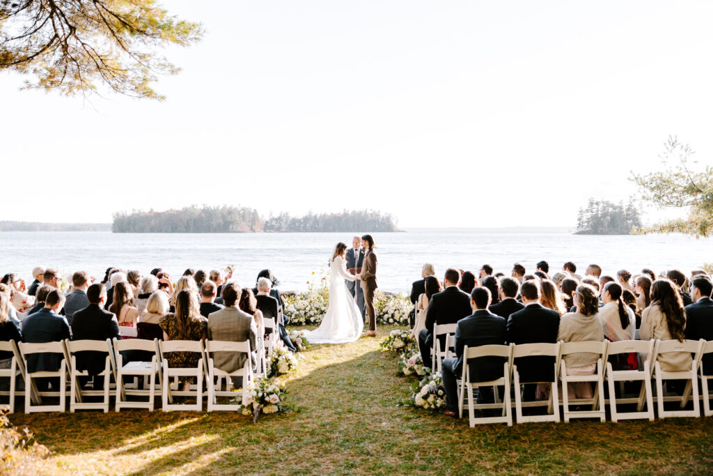 Wedding ceremony at Migis lodge lawn on Sebago lake, Maine