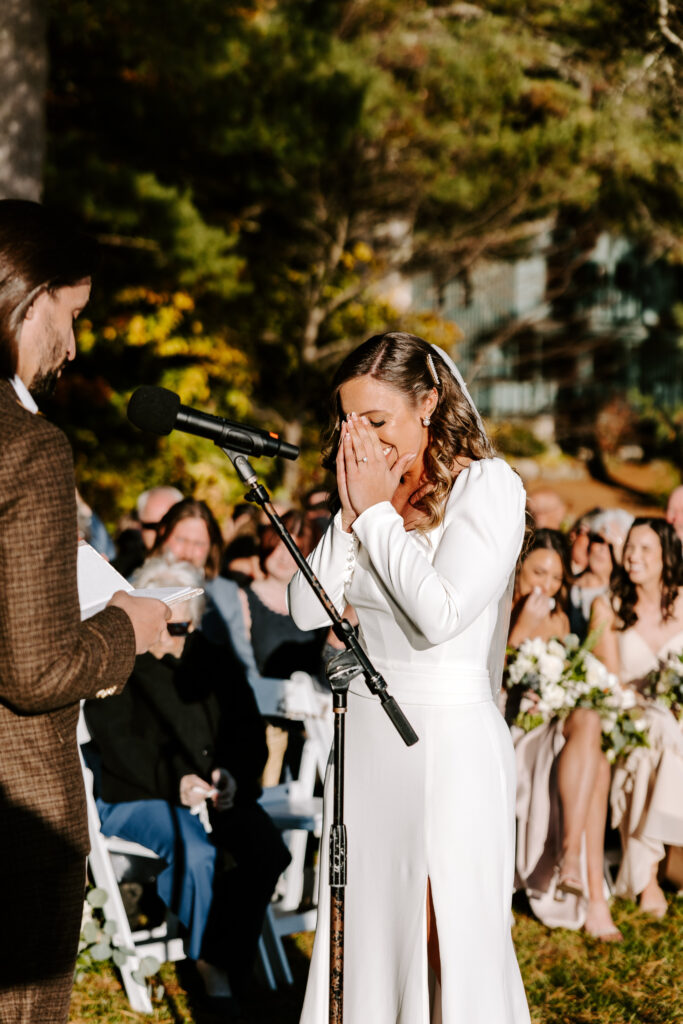 Wedding ceremony at Migis lodge lawn on Sebago lake, Maine