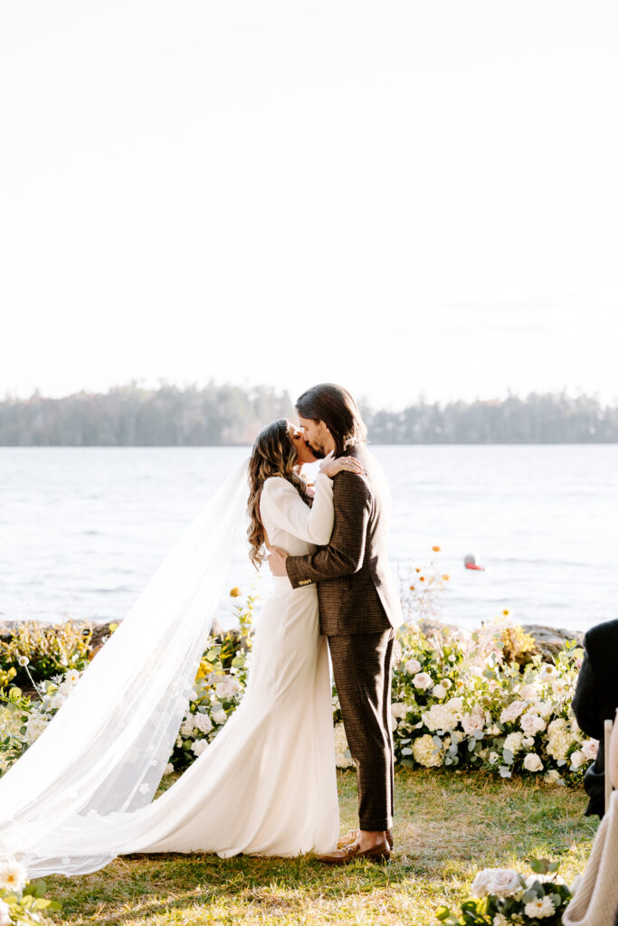 Wedding ceremony at Migis lodge lawn on Sebago lake, Maine