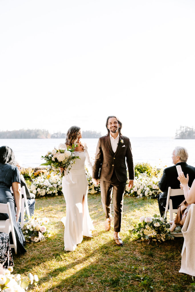 Wedding ceremony at Migis lodge lawn on Sebago lake, Maine