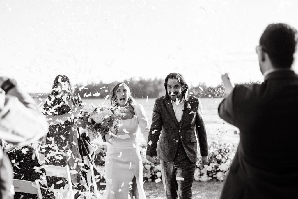 Wedding ceremony at Migis lodge lawn on Sebago lake, Maine
