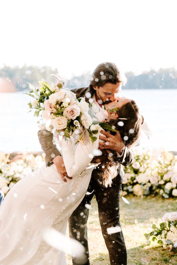 Wedding ceremony at Migis lodge lawn on Sebago lake, Maine