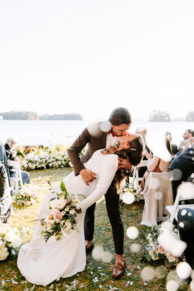 Wedding ceremony at Migis lodge lawn on Sebago lake, Maine