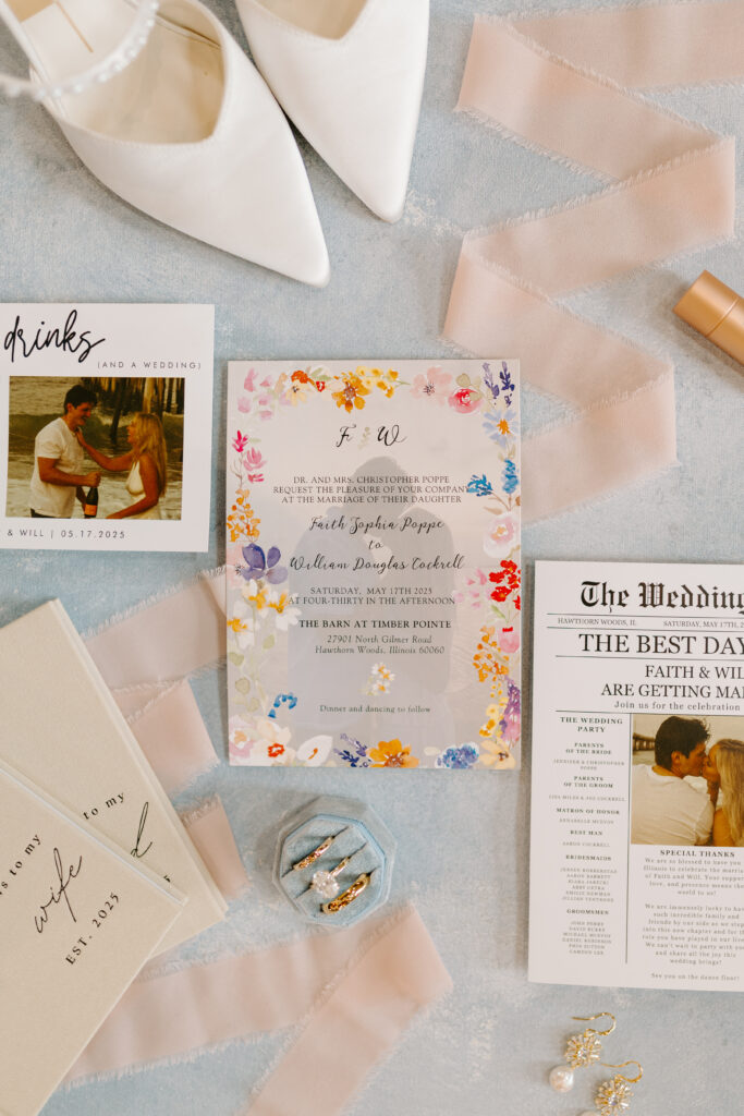 Flat lay with wedding shoes, ribbon, and wedding bands
