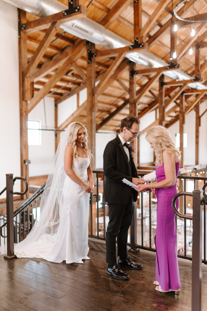 Bride does first look with father at wedding.