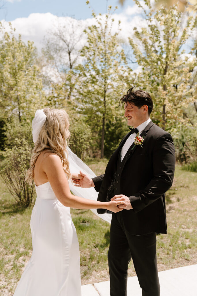 Bride and groom share first look at The Barn at Timber Pointe venue in Chicago, IL.