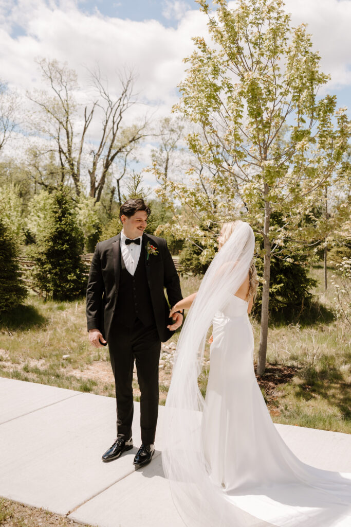 Bride and groom share first look at The Barn at Timber Pointe venue in Chicago, IL.