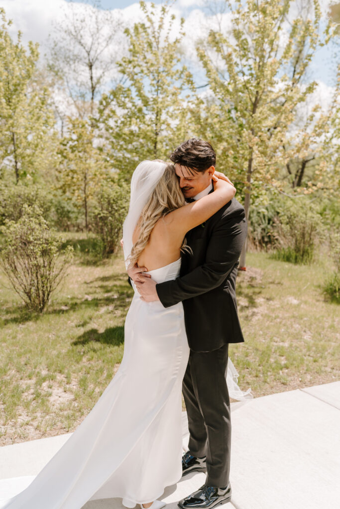 Bride and groom share first look at The Barn at Timber Pointe venue in Chicago, IL.