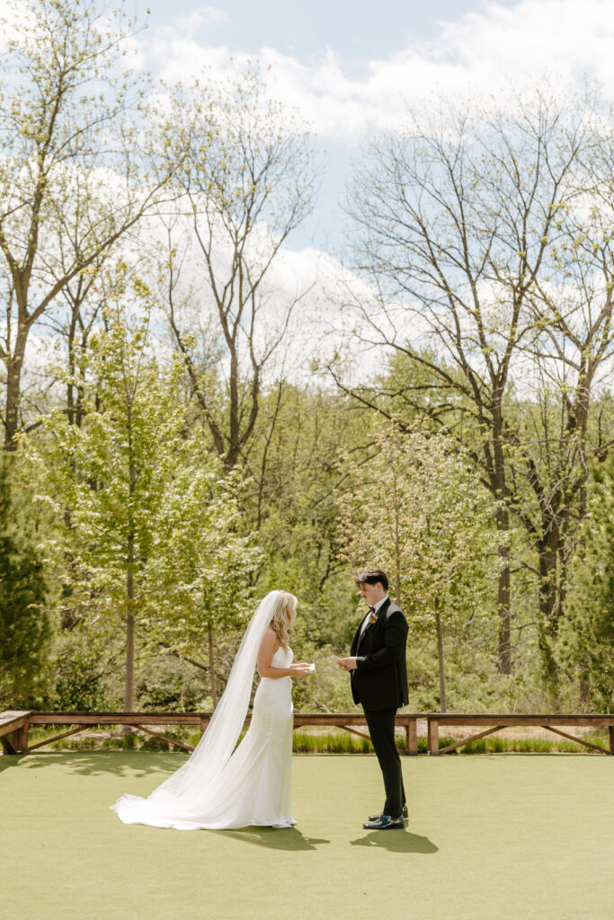 Bride and groom exchange vows at The Barn at Timber Pointe venue in Chicago, IL.