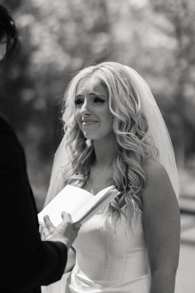 Bride and groom exchange vows at The Barn at Timber Pointe venue in Chicago, IL.
