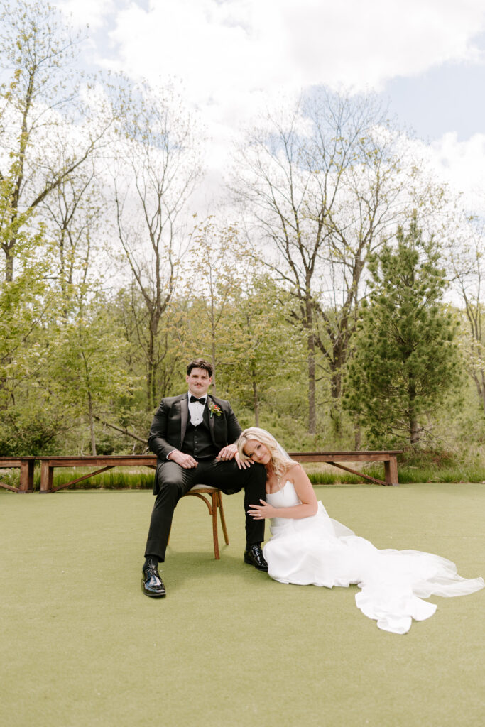 Bride and groom share editorial look for their wedding portraits at The Barn at Timber Pointe.
