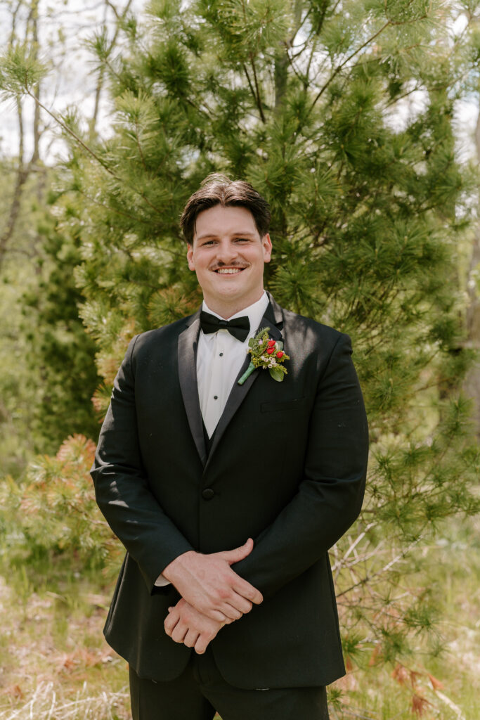 Groom smiles in portrait in Chicago, IL.