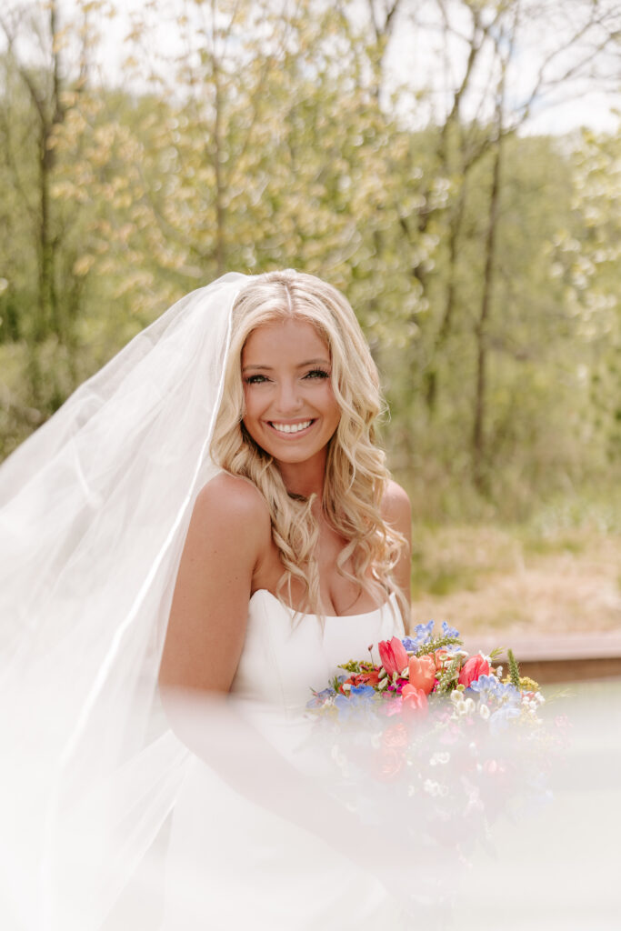 Bride smiles in portrait in Chicago, IL.