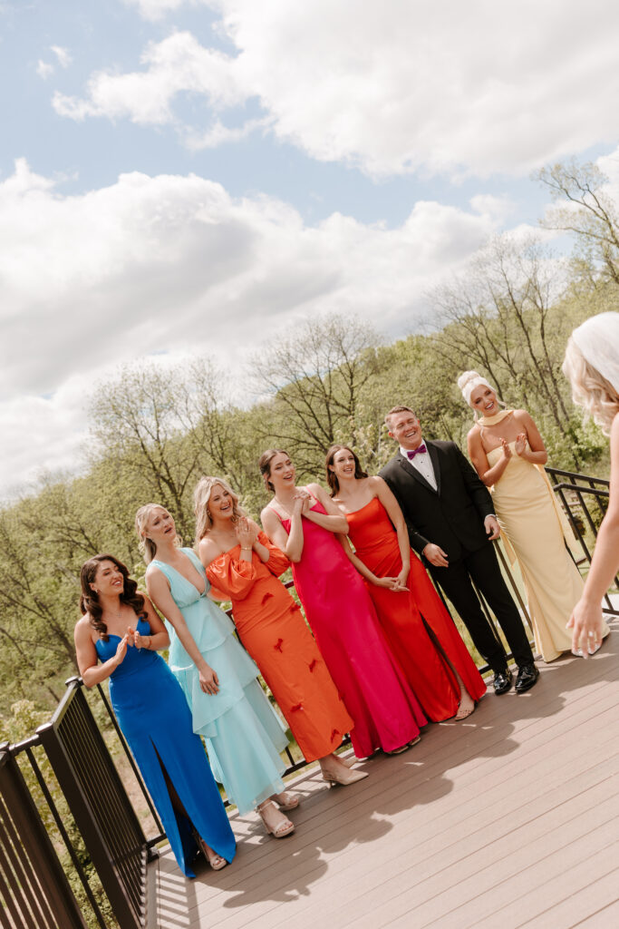 Bride does first look with wedding party at The Barn at Timber Pointe in Chicago, IL.