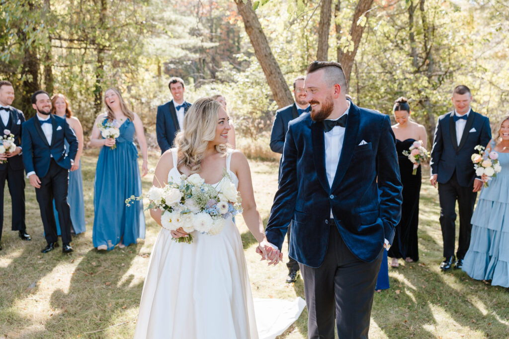 • Wedding party cheering with the bride and groom on Great Diamond Island