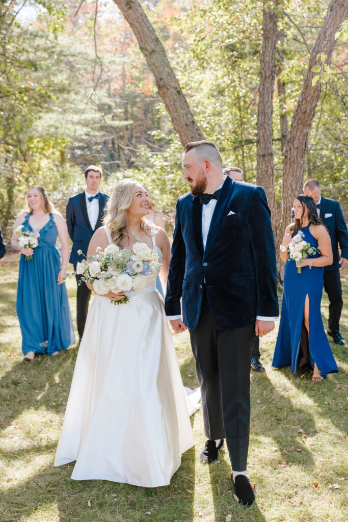 • Wedding party cheering with the bride and groom on Great Diamond Island
