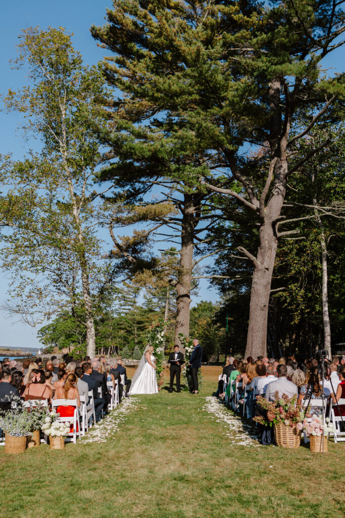 Emotional ceremony moment with the couple surrounded by family and friends on Great Diamond Island