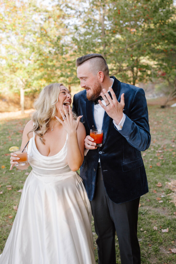 Bride and groom show off wedding bands