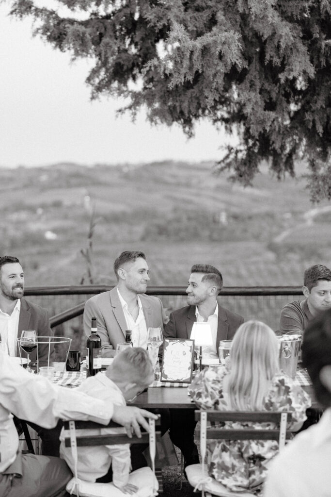 Grooms share moment during speech given in Tuscany