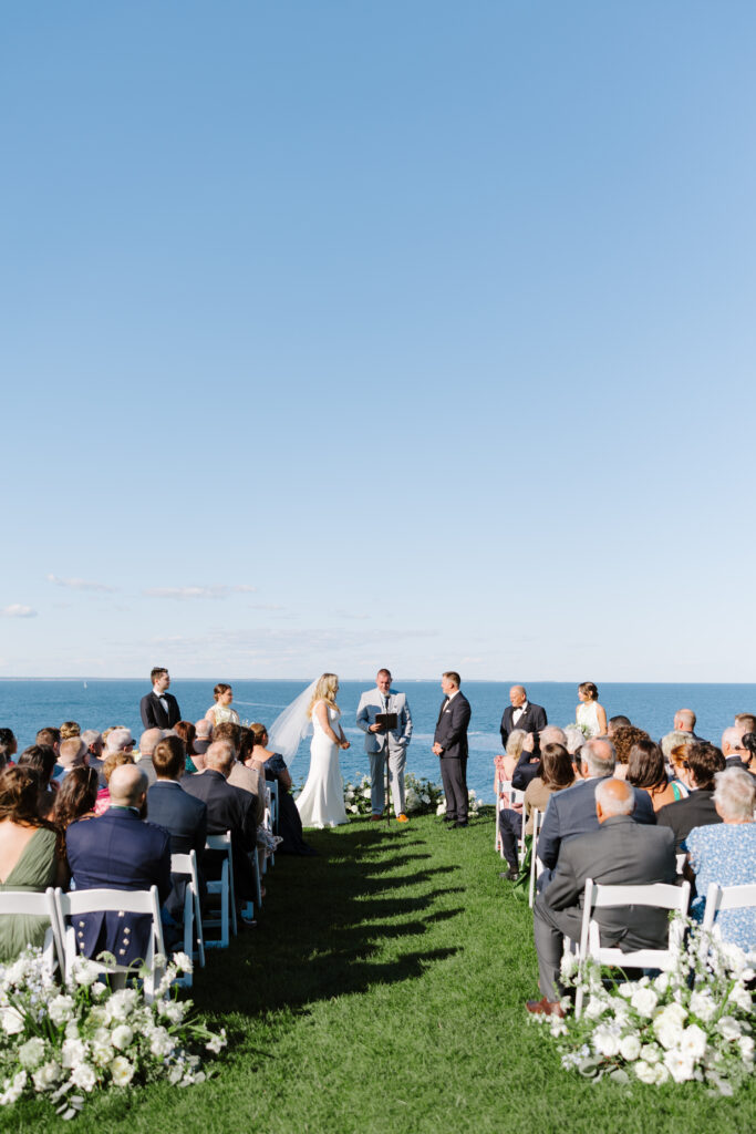 Bride and groom exchange vows at the Cliff House venue in maine.