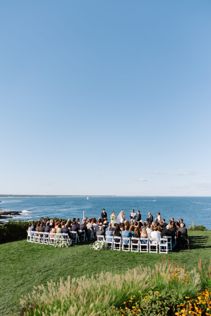 Wedding ceremony at the cliff house maine in the summer.