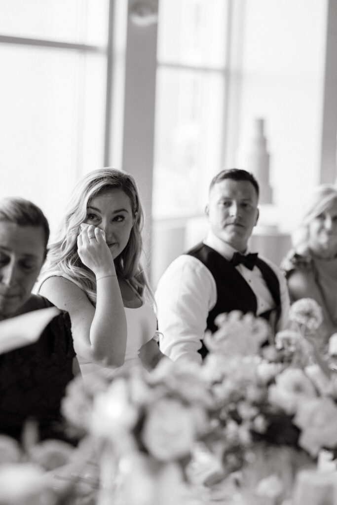 Bride tears up at speech during her wedding reception at Cliff House in Maine.