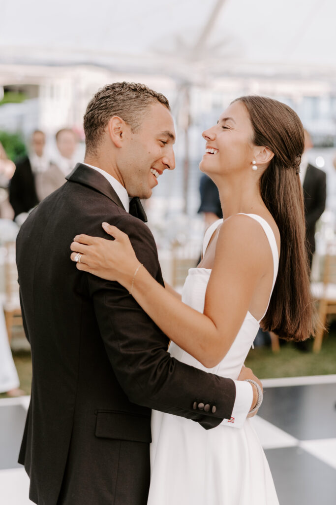 bride and groom share first dance at wedding reception