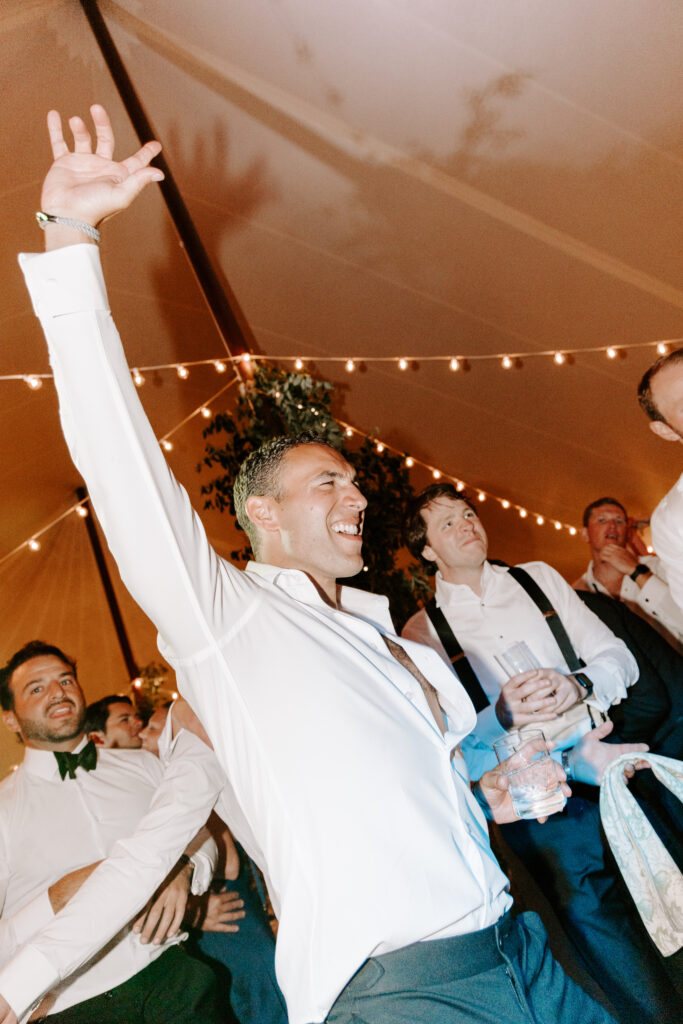 groom dancing at wedding reception