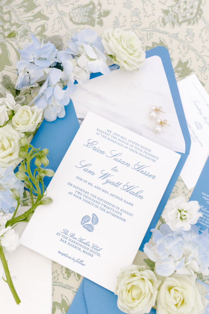 blue and white wedding invitation with floral