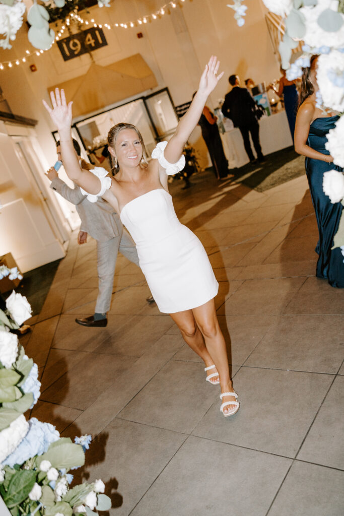 bride dances with friends at wedding reception