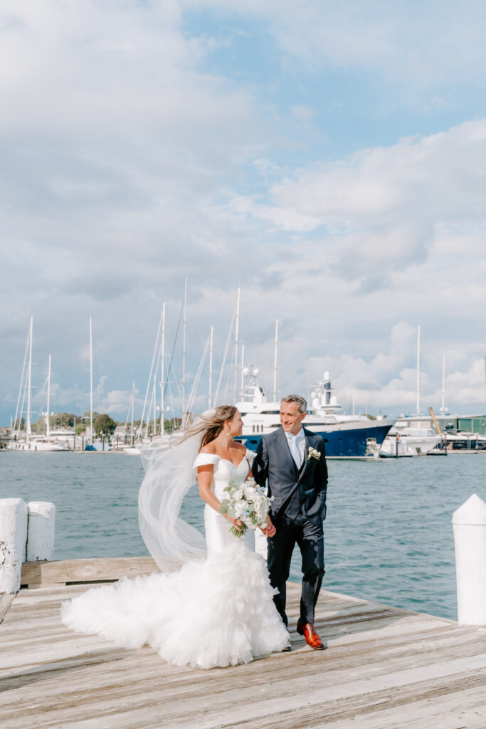 Molly and Doug wedding ceremony at Regatta Place in Newport RI with blue and white hydrangeas