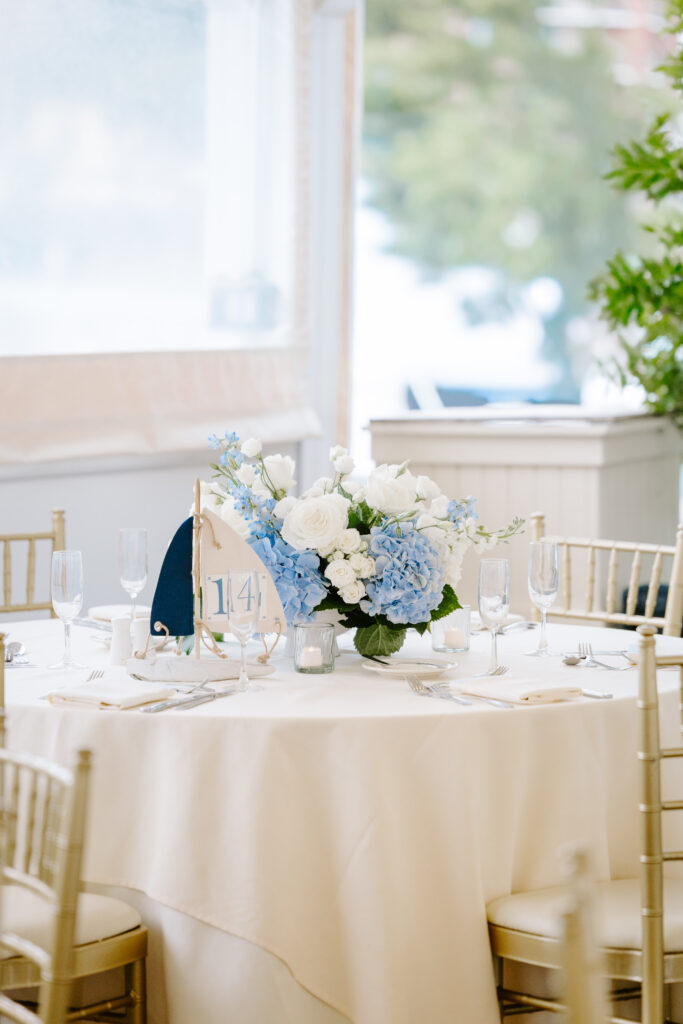 blue and white hydrangeas on table at wedding reception at regatta place in newport