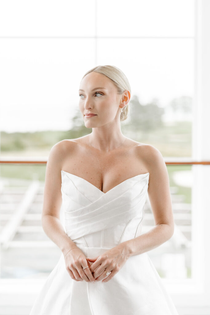 bride smiles at camera on wedding day taken by boston wedding photographer