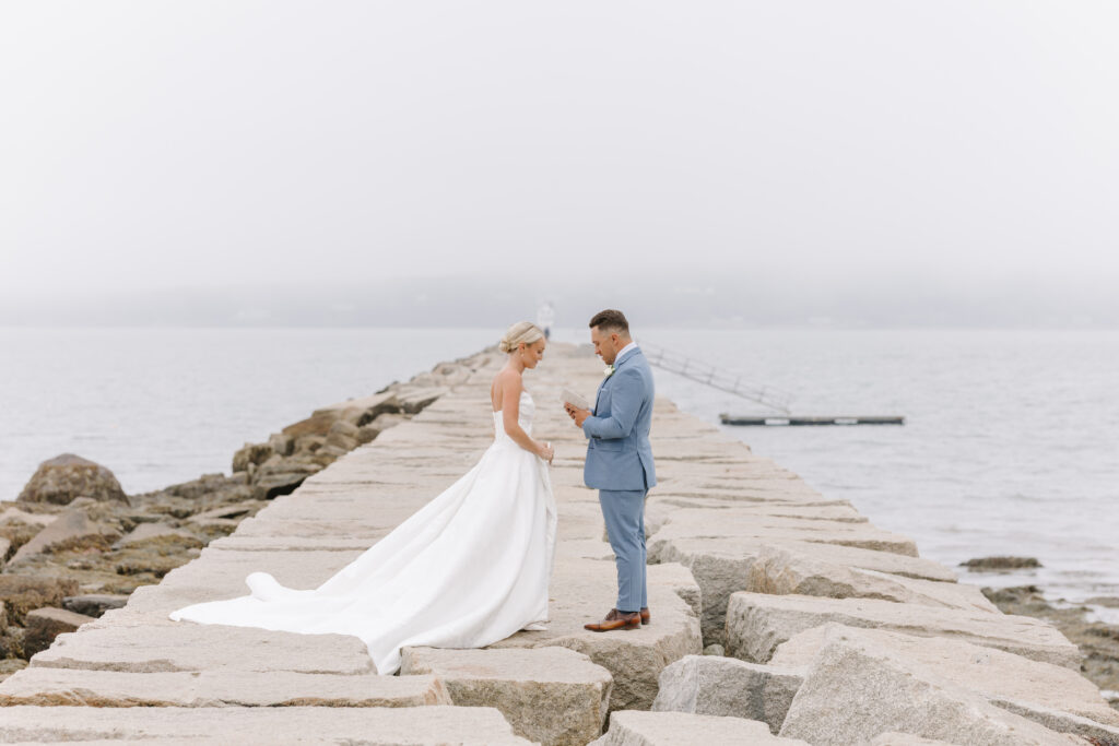 bride and groom exchange vows on wedding day at the samoset taken by maine wedding photographer