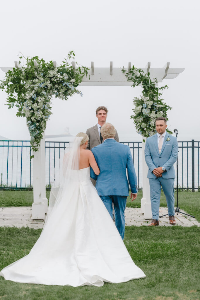 bride walks down the aisle at wedding ceremony on the eastcoast