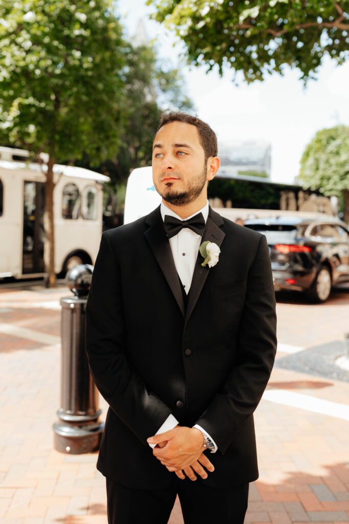 groom smiles on wedding day in boston, massachusetts