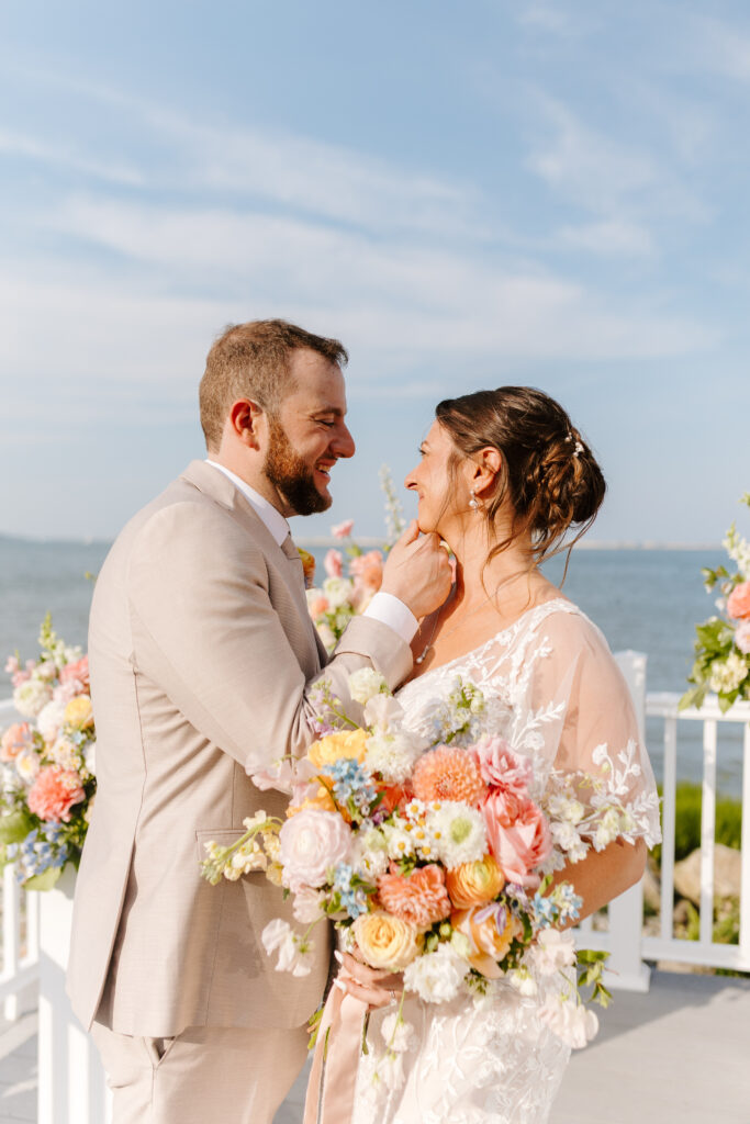 bride and groom look at each other taken by cape cod photographer