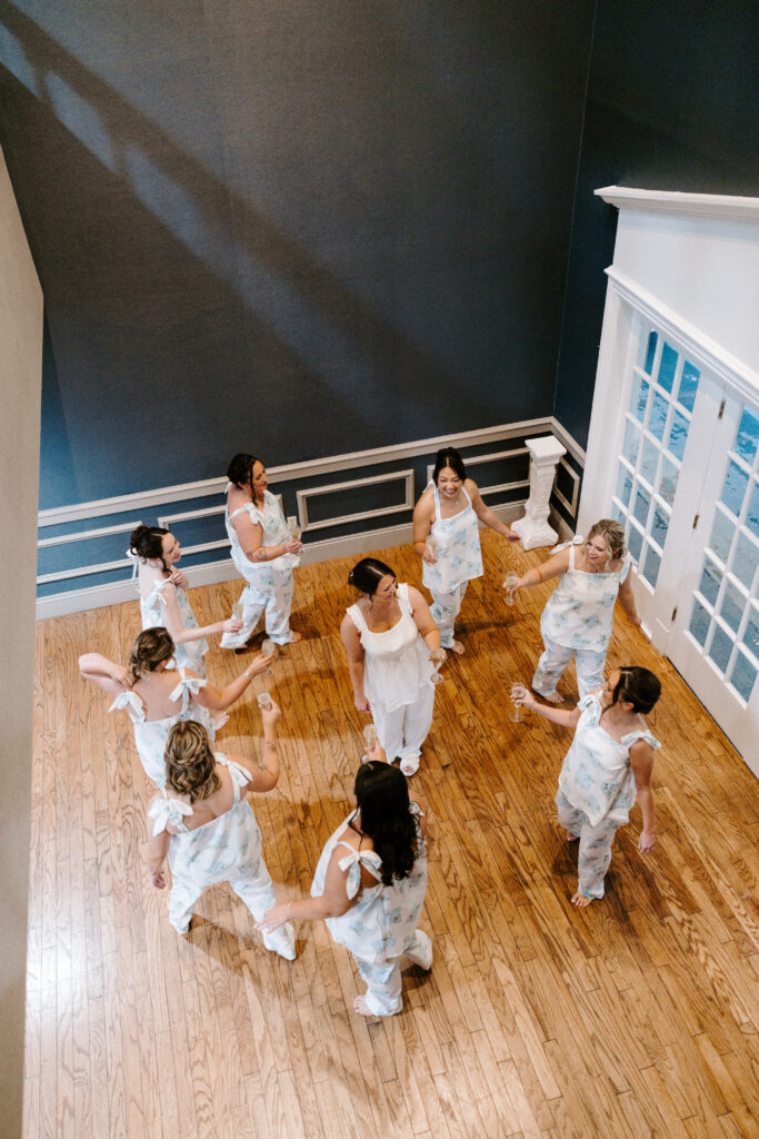 bridesmaids dance around bride before wedding ceremony
