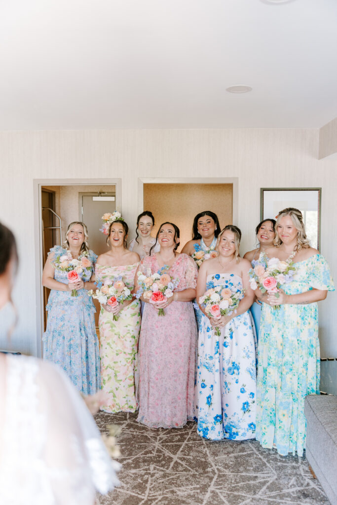 bridesmaids react to bride in wedding dress taken by cape cod wedding photographer